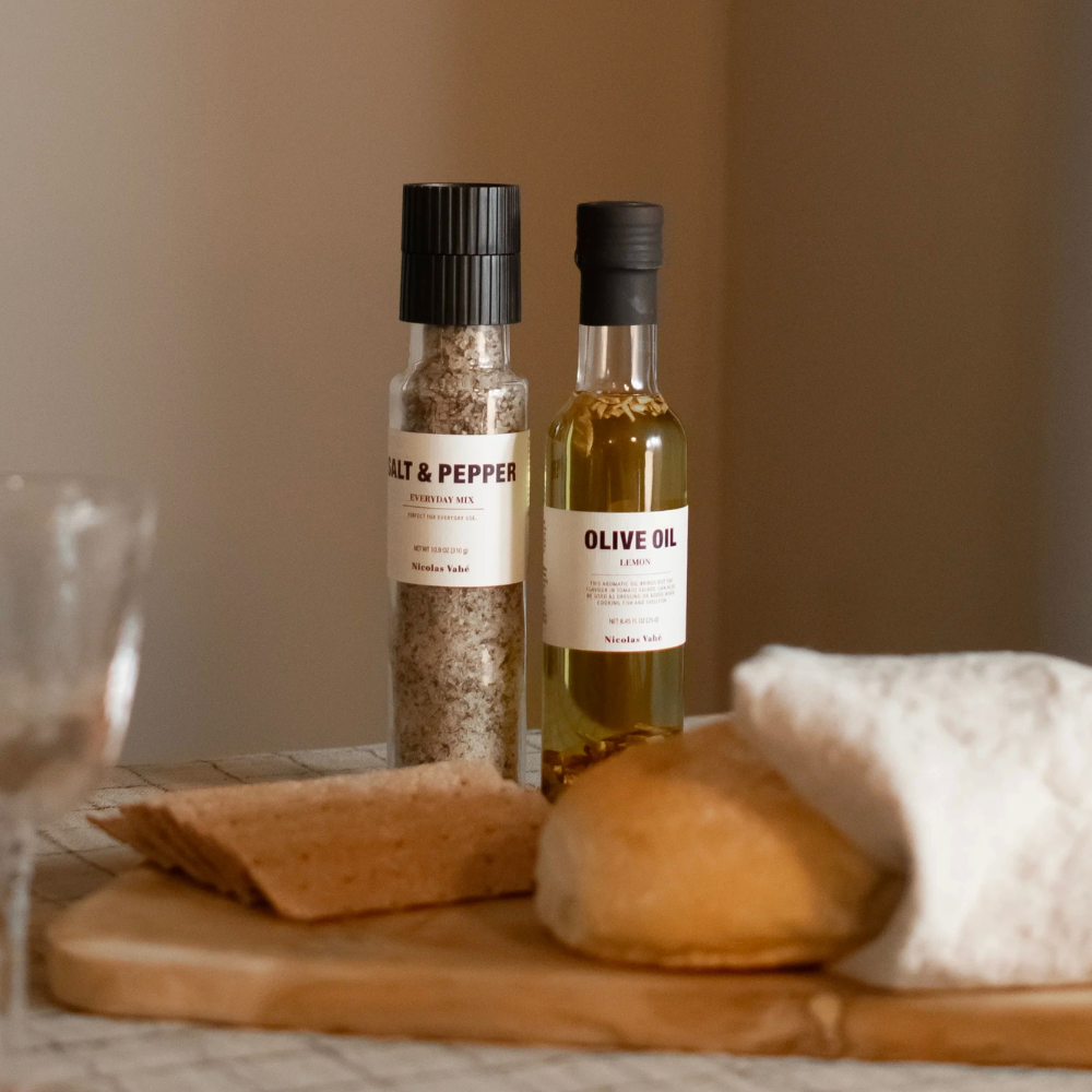 Nicolas Vahé salt & pepper blend and olive oil on a dining table