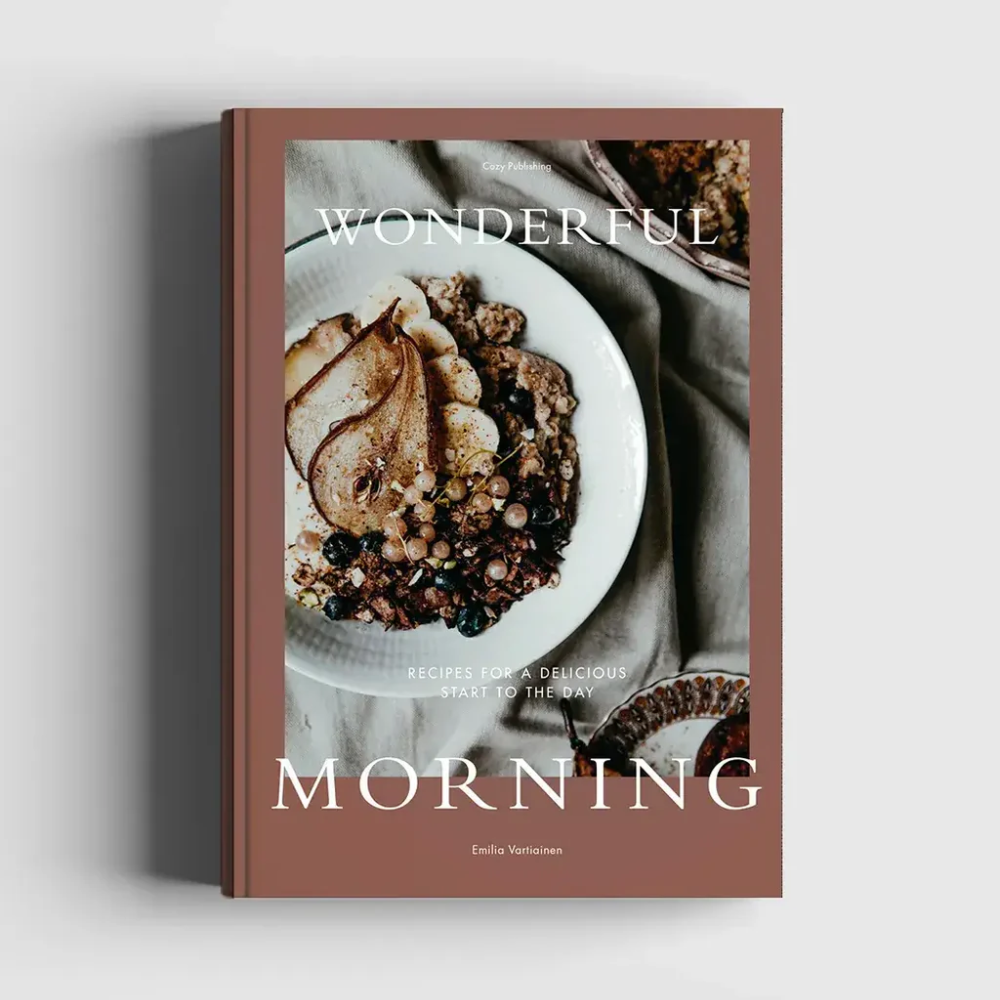 A cookbook titled Wonderful Morning features a cover photo of a bowl with granola, fruit, and nuts, with the subtitle Recipes for a Delicious Start to the Day on a brown background.
