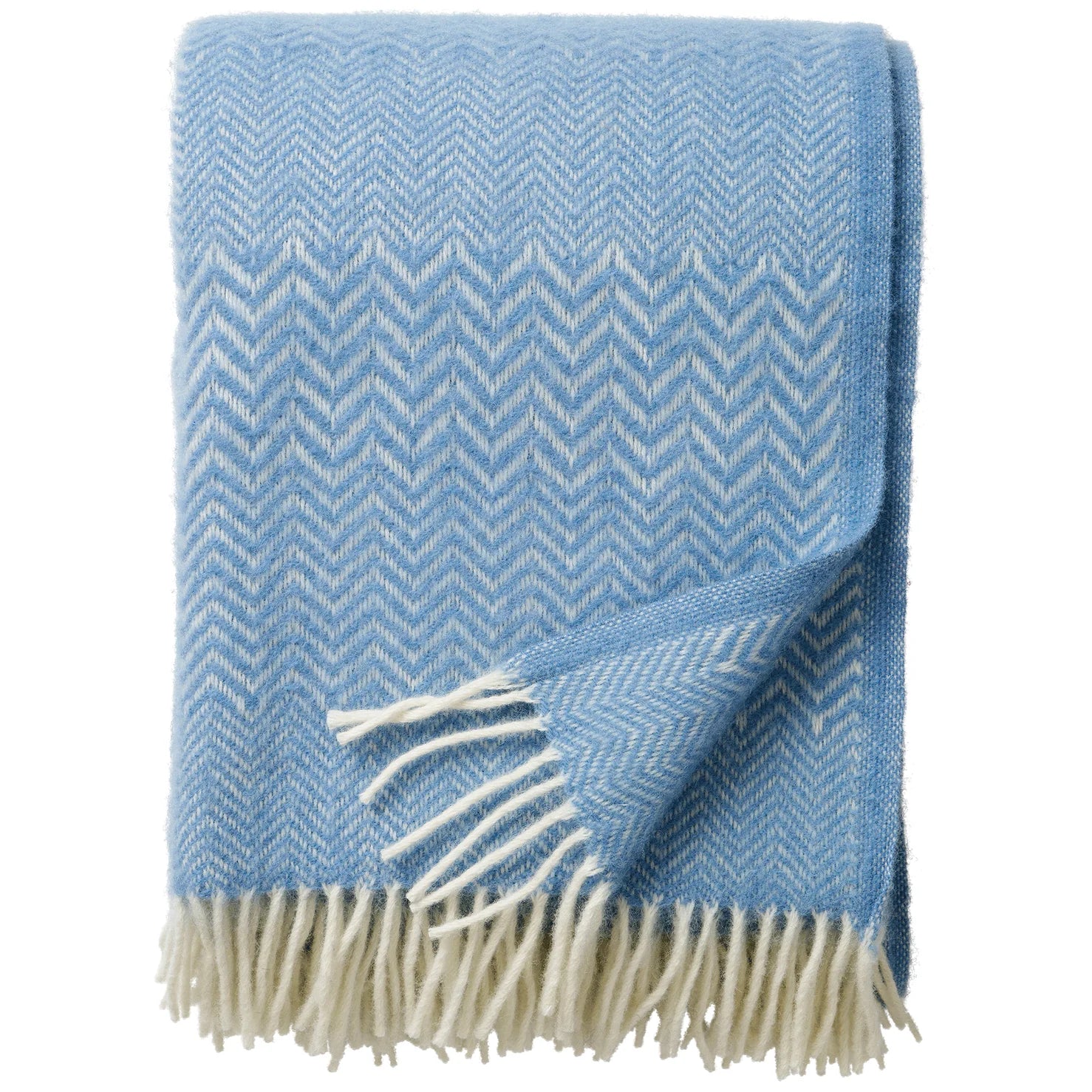 The Klippan Zigzag Throw in Lambswool, Infinity Blue features a light blue and white herringbone pattern with fringed edges—a cozy, stylish addition to any home decor.