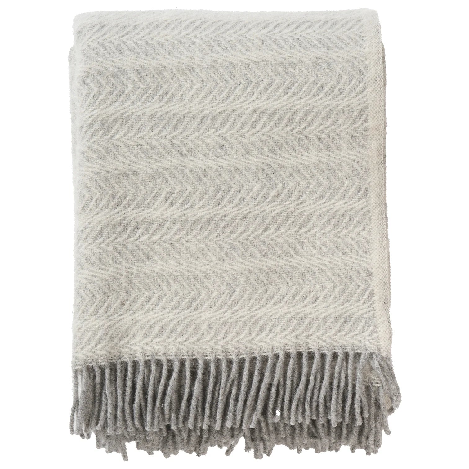 The Klippan Alm Throw in Eco Lambswool, Ash, features a subtle herringbone pattern and gray fringe along one edge—a cozy, light gray accent for your home décor.