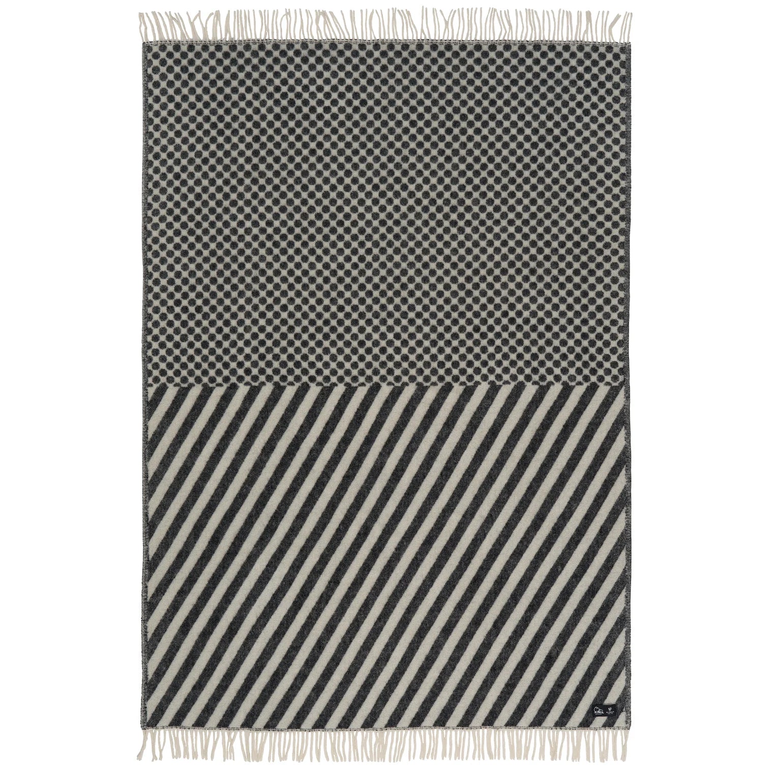 The Klippan Dot & Stripe Lambswool Throw in Black/White adds a stylish touch to any room and is perfect for elevating your home decor.