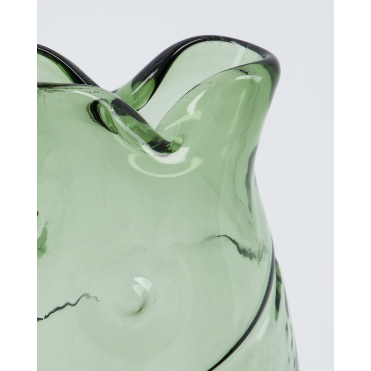 Close-up of the Vase Fish by House Doctor, a green glass vase with wavy edges and a textured surface, shown against a plain white background.