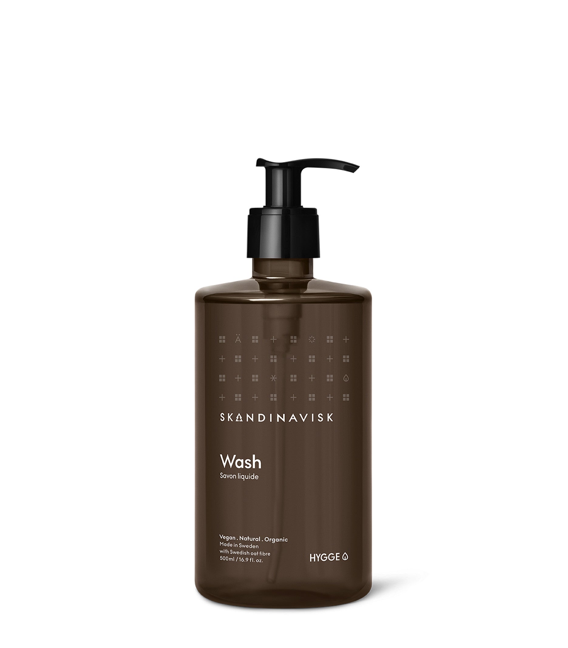 A brown 500 ml pump bottle labeled Skandinavisk Hand Wash Hygge, featuring white text and a minimalist design. This hand and body wash is crafted with vegan, natural, and organic ingredients—including organic aloe vera—and perfectly captures the essence of Scandinavian hygge.