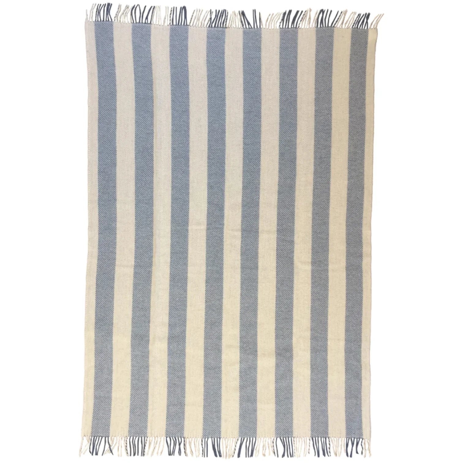 The Gotland Throw by Klippan features vertical blue and white stripes, is woven from brushed Gotland wool and lamb’s wool, and is finished with short fringe along the shorter edges.