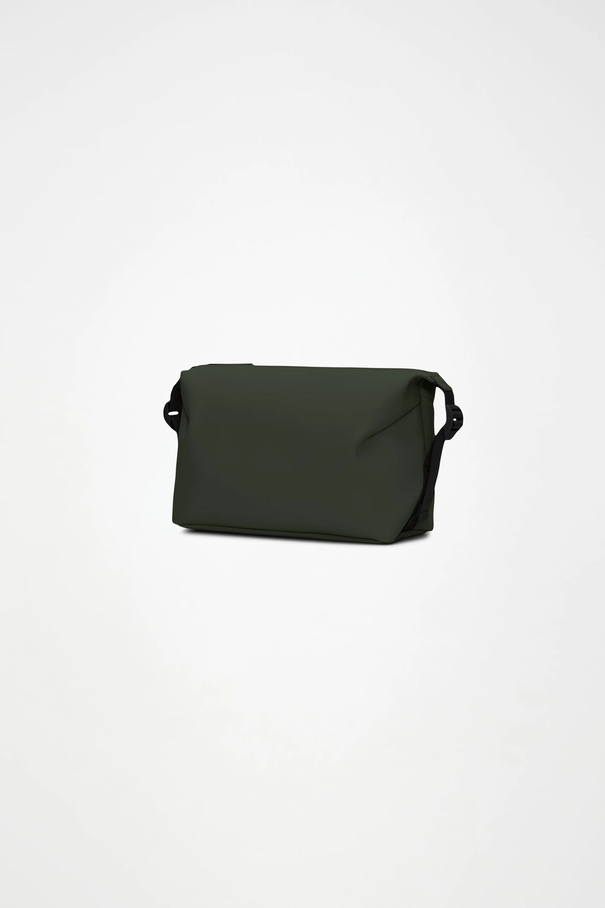 The Rains Hilo Wash Bag W3 in Green by Rains is a dark green rectangular bag with a flap closure and black side details, designed to double as a travel wash bag, shown against a plain white background.