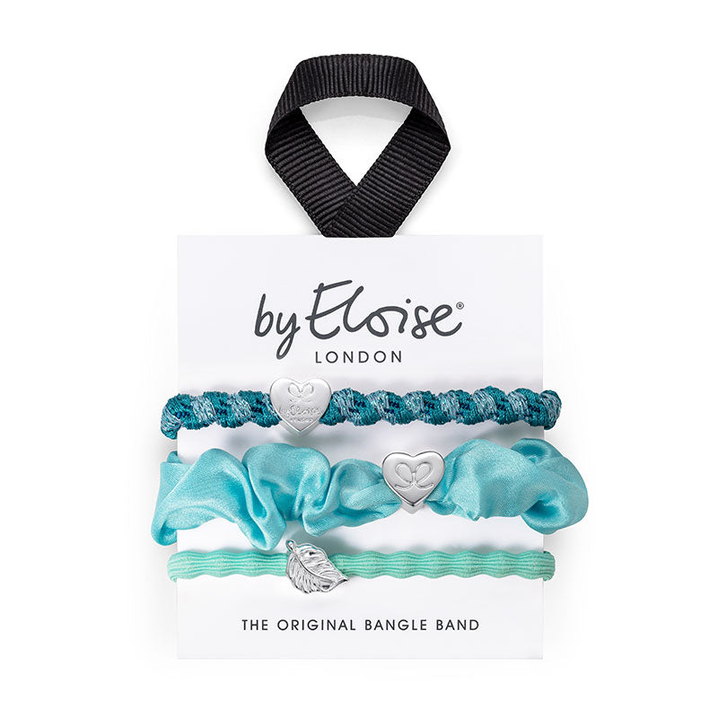 The ByEloise Bangle Band Waterspout Set includes three turquoise hairbands with silver charms, attached to a branded card with black ribbon. Stylish and practical, theyre perfect for adding a pop of color to any look.