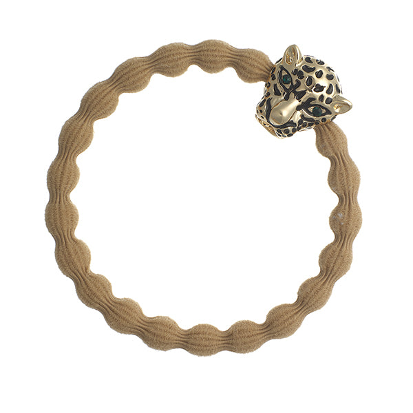 The ByEloise Bangle Band in Camel features a wavy elastic design and is adorned with a gold jaguar charm set with sparkling green diamanté eyes.