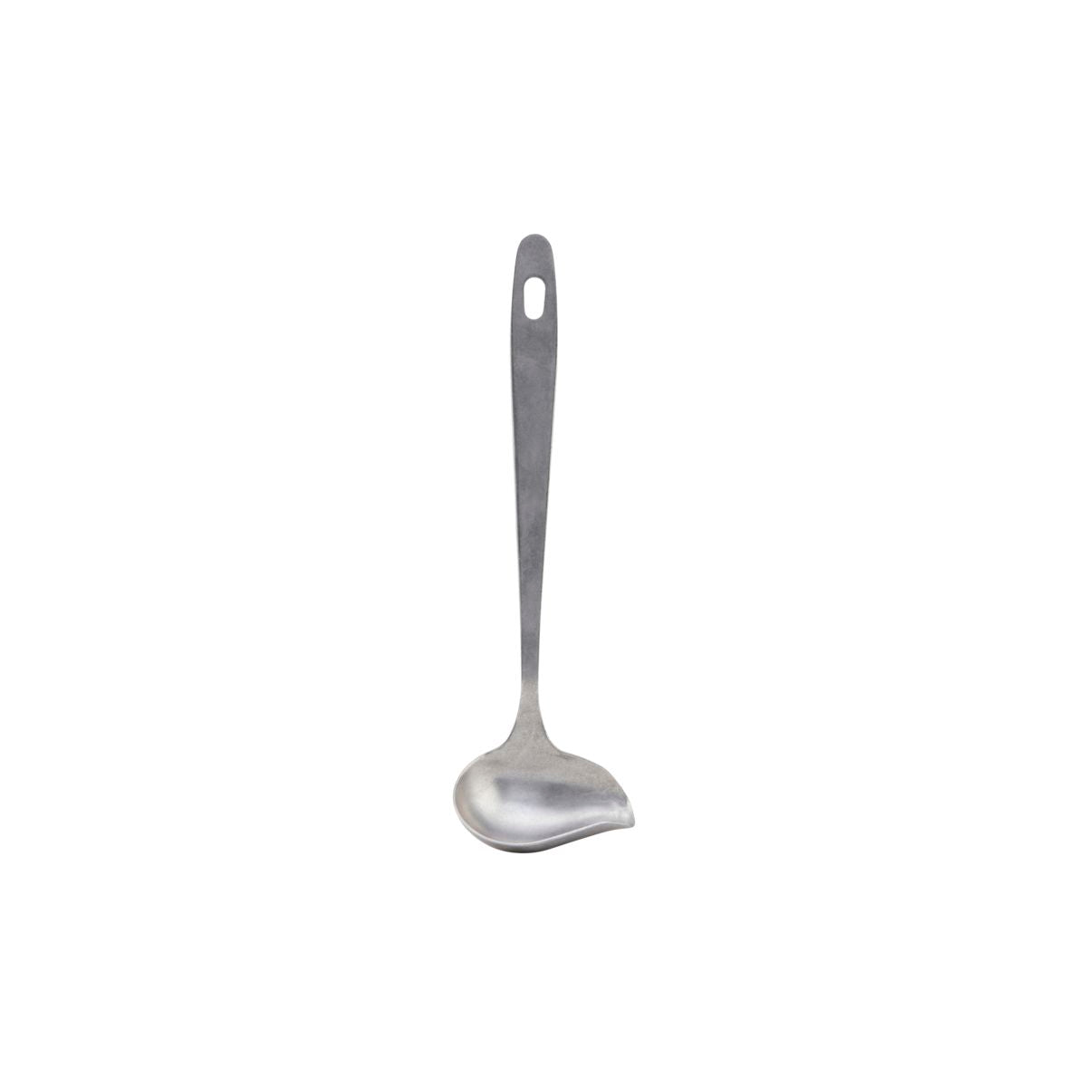 The Sauce spoon Daily by Nicolas Vahé boasts a silver finish, a long handle with a hanging hole, and is shown against a white background.