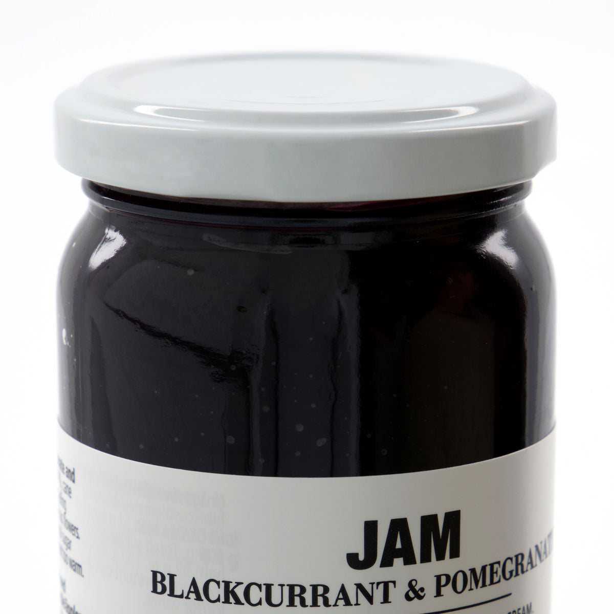 Nicolas Vahé Jam - Blackcurrant & Pomegranate comes in a glass jar with a white lid, offering a rich, gourmet fruit spread perfect for blackcurrant lovers.