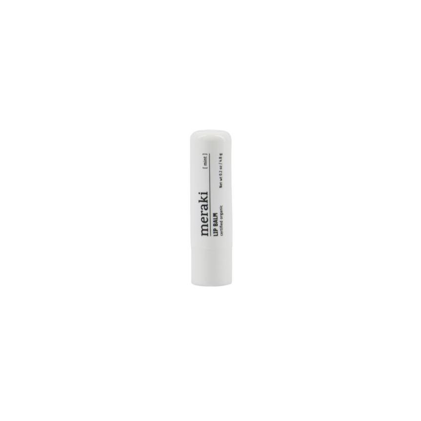 A white cylindrical Meraki Organic Lip Balm, Mint, tube stands upright against a plain white background.