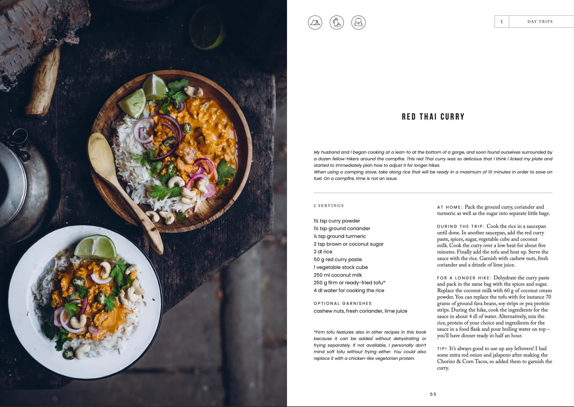 Overhead view of a wooden table with two bowls of Red Thai Curry and rice, featured in Food in the Woods - Vegetarian Recipes From Easy Snacks to Hiking Meals by Cozy Publishing; recipe instructions appear on the right page.