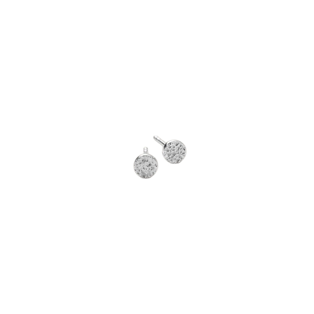 The Mini Nature Earsticks Earrings in Silver by Pernille Corydon are small, round studs with a textured surface, perfect for everyday wear. Shown on a plain white background.