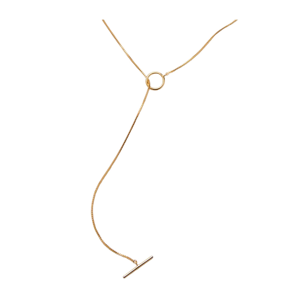 Gold necklace with a small pendant on a white background