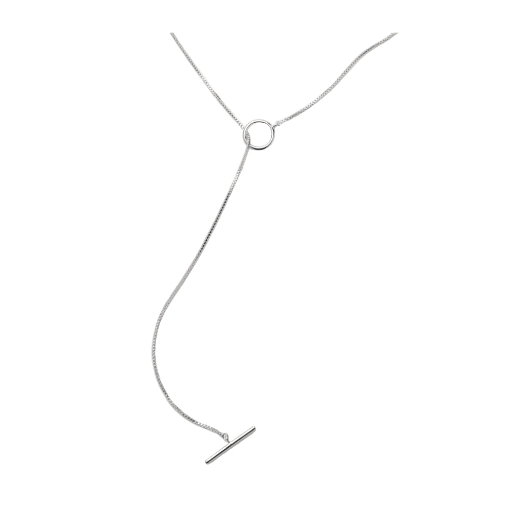 The Hope Necklace in Silver by Pernille Corydon features a minimalist design with a thin chain, circular ring, and bar pendant. Adjustable for versatile styling, it's shown on a white background.