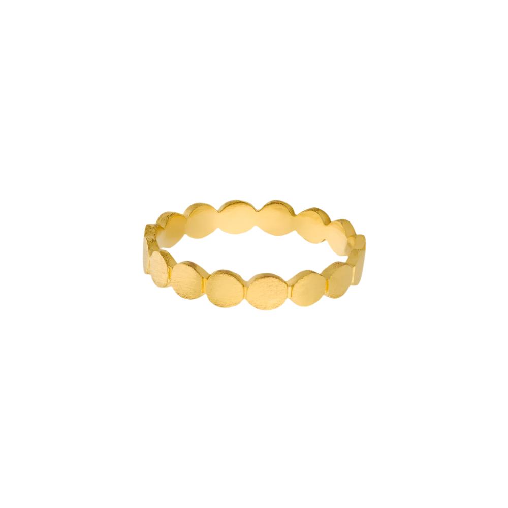 The Catena Ring in Gold by Pernille Corydon features a continuous pattern of round, flat discs along the band—an enchanting accessory to elevate your summer style.