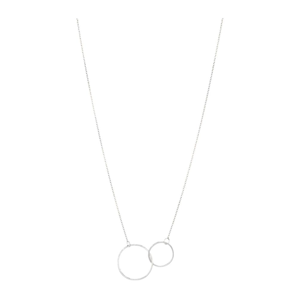 The Double Plain Ring Necklace in Silver by Pernille Corydon features two interlocking open circles of different sizes on a fine chain, creating a minimalist and elegant jewelry piece.