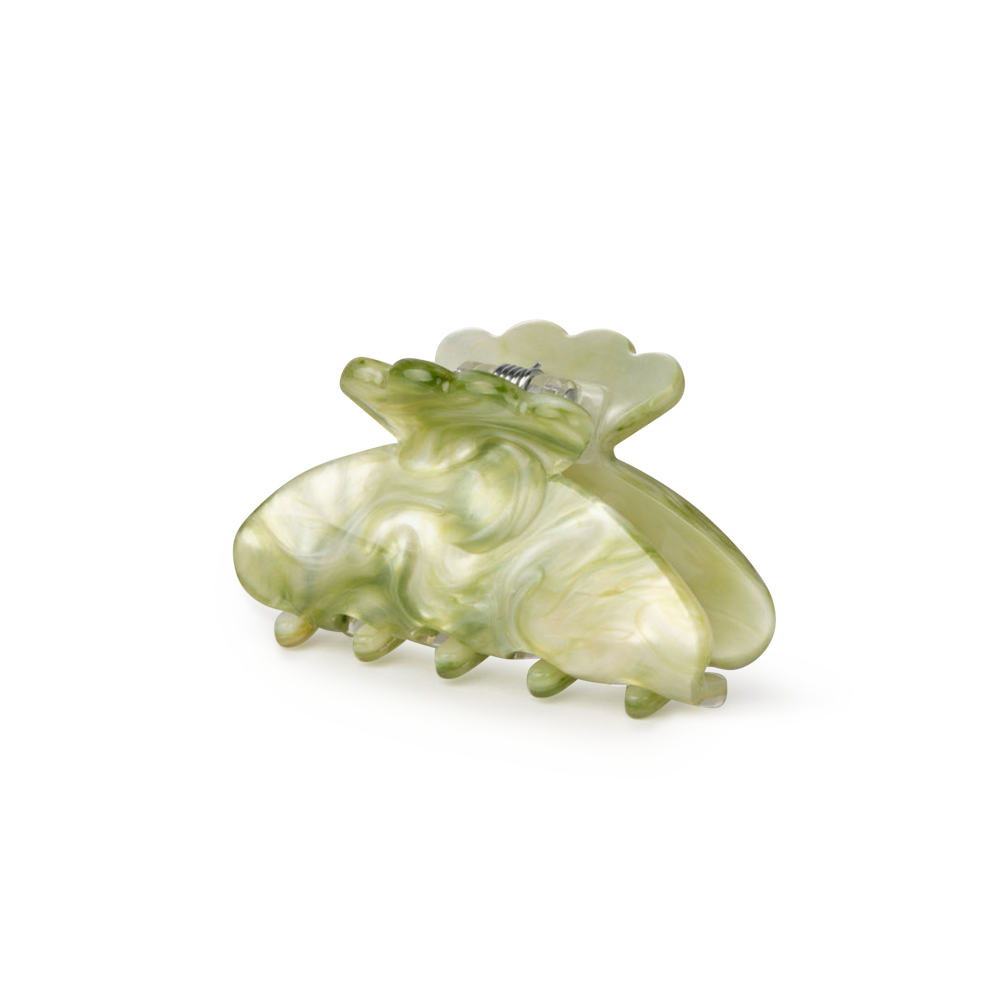 The Sui Ava Helle Matcha Mini Hair Claw Clip in Cool Green features marbled acetate, curved edges, and a spring mechanism, shown against a plain white background.