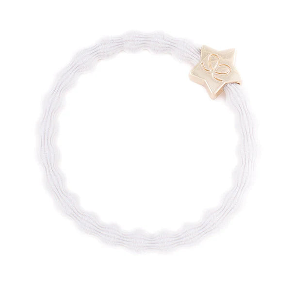 The ByEloise Bangle Band Gold Star · Crisp White is a white elastic hairband with a gold star-shaped charm engraved with a delicate bow, shown against a plain white background.