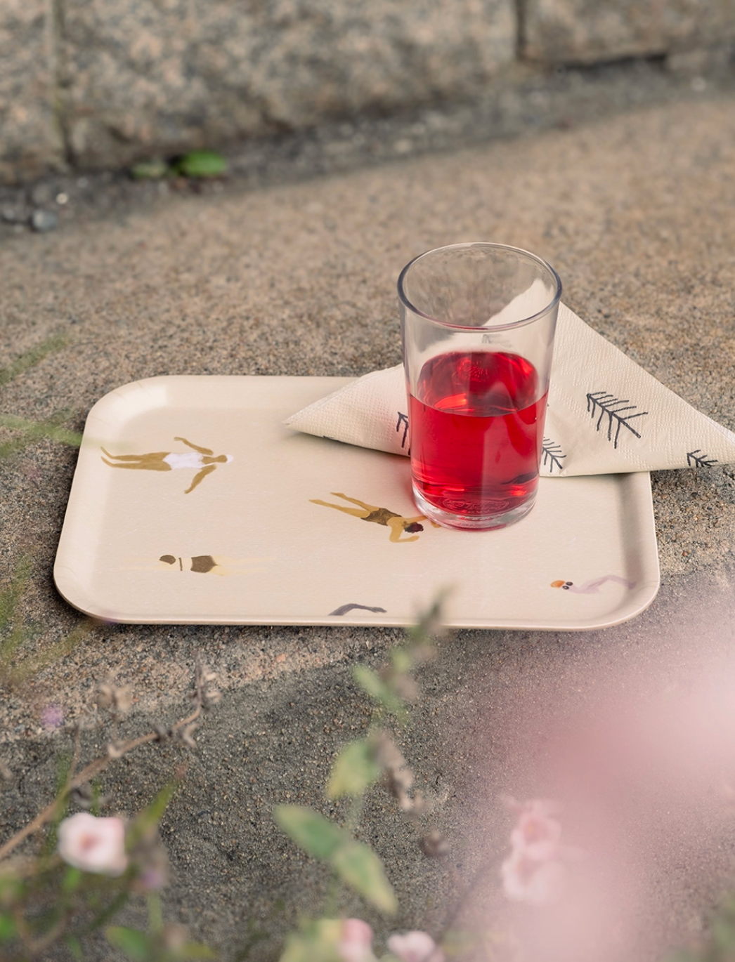 Swimmers tray small in sand with drink and napkin, made from laminated birch wood, perfect for kitchen use.