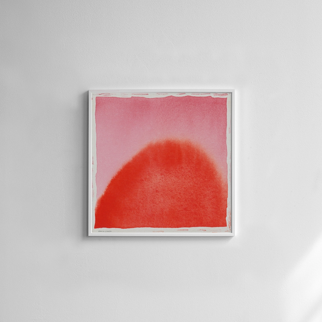 The Sun Print (70 cm x 70 cm) by Fine Little Day features a red semicircle with soft edges on a pink background, framed in white—a vibrant, colorful wall art piece ideal for brightening any space.