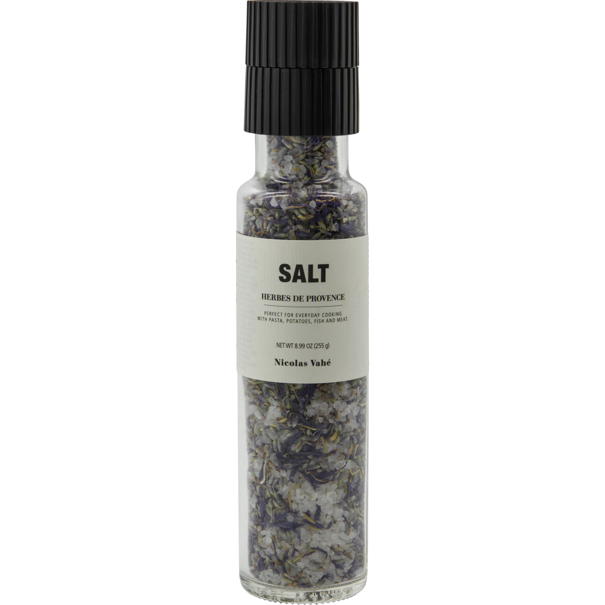 A clear glass grinder bottle of Nicolas Vahé Salt, Herbes de Provence, featuring sea salt and herbs like rosemary. It has a simple white label, black grinder top, and delivers a savoury finish.