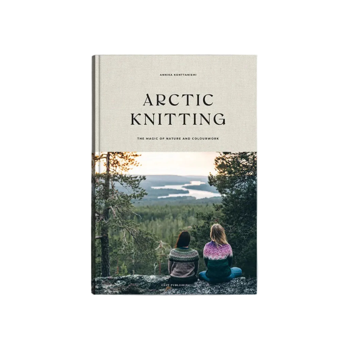 The cover of Arctic Knitting, The Magic of Nature and Colourwork by Cozy Publishing features two people in vibrant Lapland-style knits overlooking a forest and lake, with a beige top displaying the book’s title and author.
