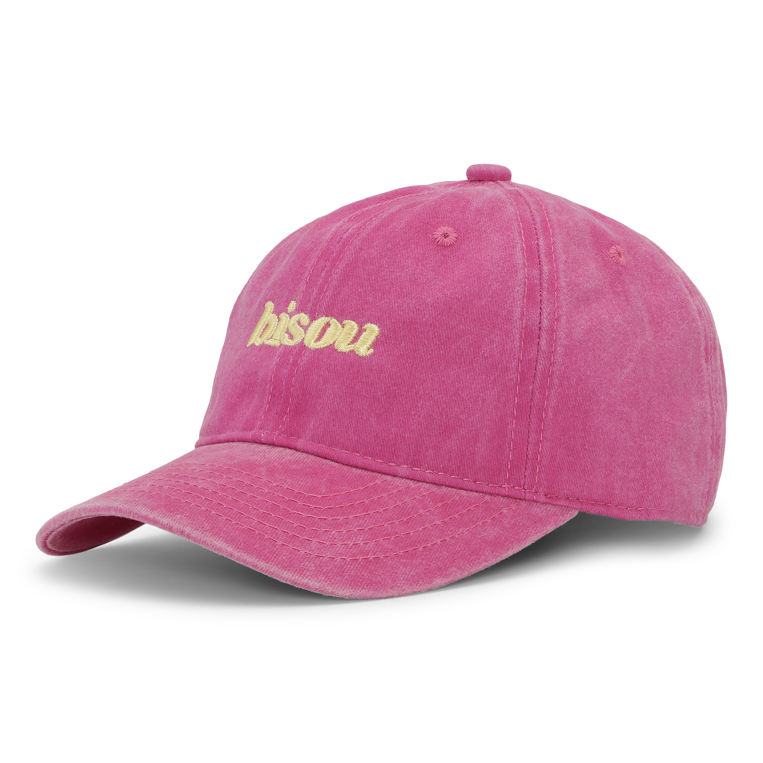 The Sui Ava Everyday Cap, Bisou in Pink, is a pink cotton cap with "bisou." yellow embroidery on the front, an adjustable strap, and is shown against a plain white background.