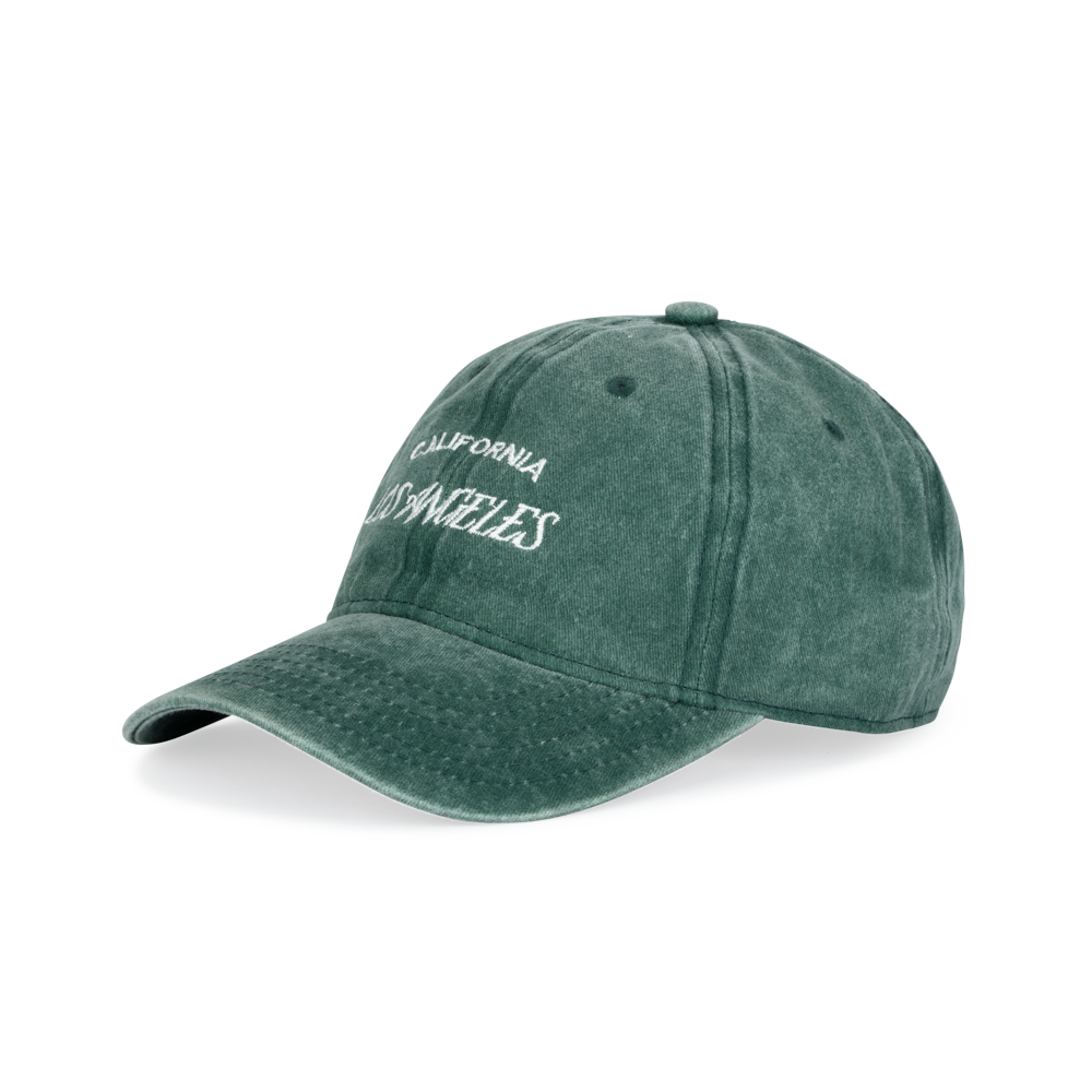 The Sui Ava Everyday Cap in Washed Green features white "Los Angeles" embroidery, a curved brim, vintage style, and an adjustable strap for comfort.