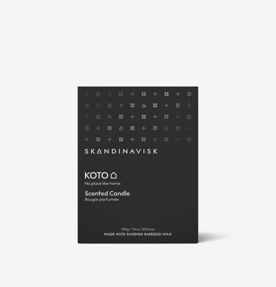 A black rectangular Skandinavisk Scented Candle Koto 50h, 200g box features white text, geometric symbols, and Nordic home fragrance details on the front.