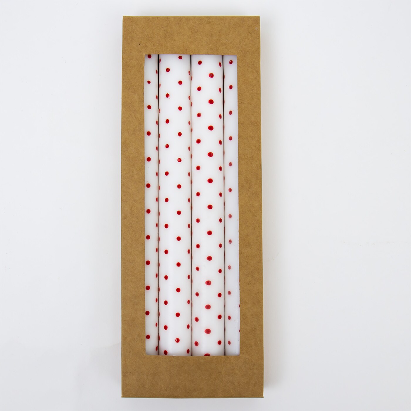 A World of Craft’s Dotted Candles 4 pack features soy wax red polka dot candles, hand-painted for charm, neatly arranged side by side in a rectangular box with a clear window.