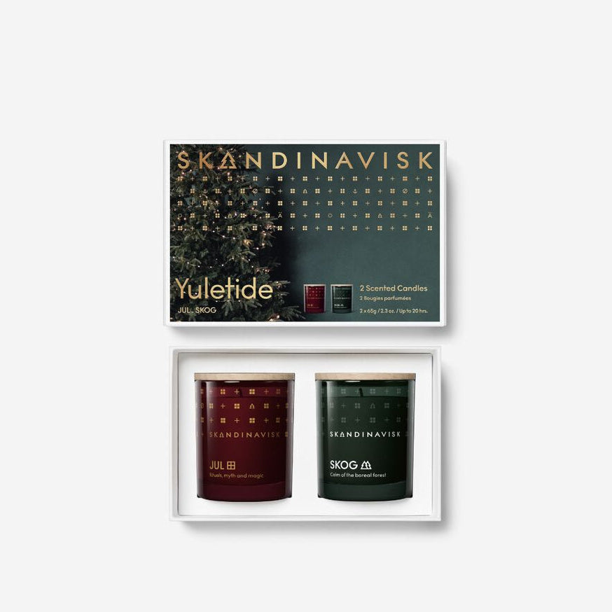 The Skandinavisk Giftset Yuletide includes two mini scented candles, Jul & Skog, in festive packaging with a tree design—perfect as a holiday candle duo.