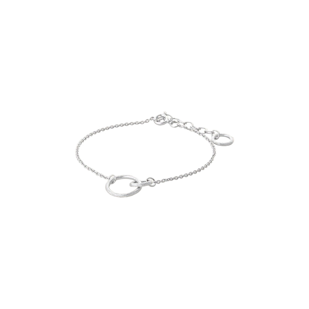 The Pernille Corydon Double Bracelet in Silver features two linked circles—a small hammered charm and a larger one—on a delicate chain, with an adjustable clasp and extra loops for the perfect fit.