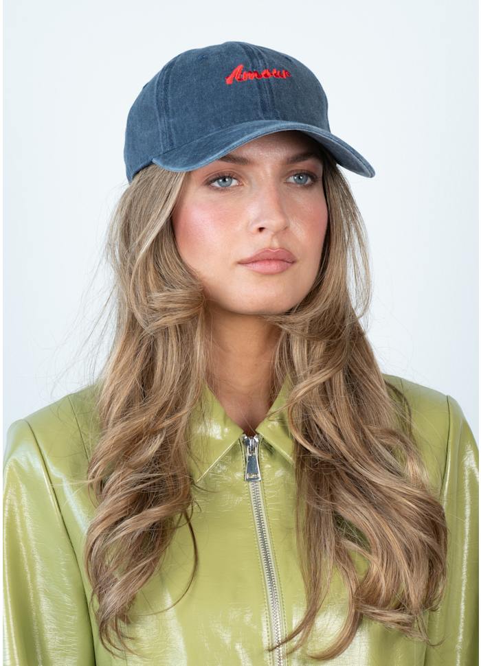 Sui Ava Everyday Cap, Amour in Blue & Red: a blue cotton cap embroidered with the word Amour in red script.