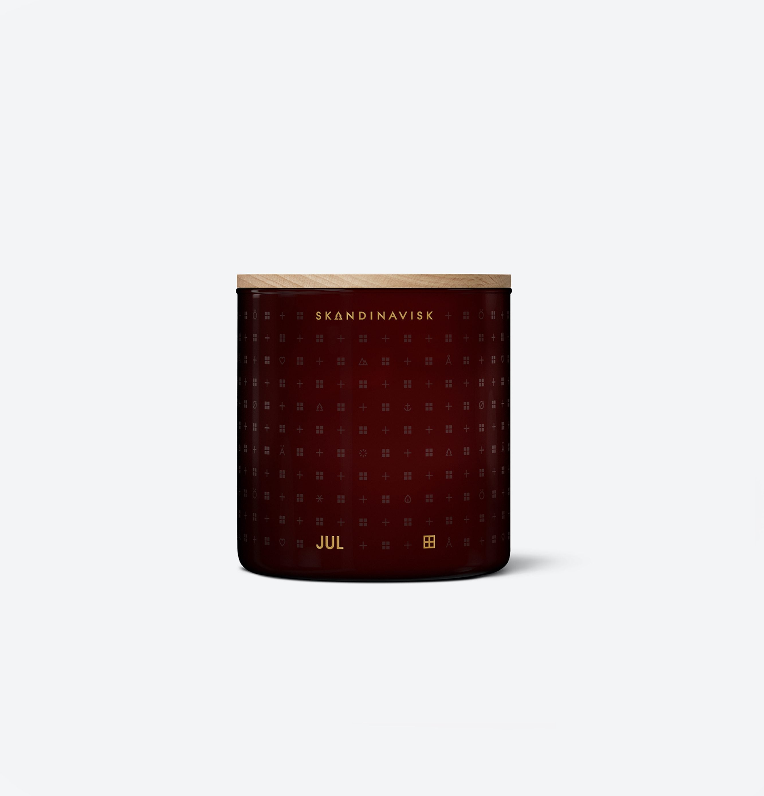 The Skandinavisk Seasonal Jul Scented Candle (2 wick, 400g) is dark red with a wooden lid, gold geometric patterns, and SKANDINAVISK and JUL in gold text on the front, made from Swedish rapeseed wax, shown on a plain white background.
