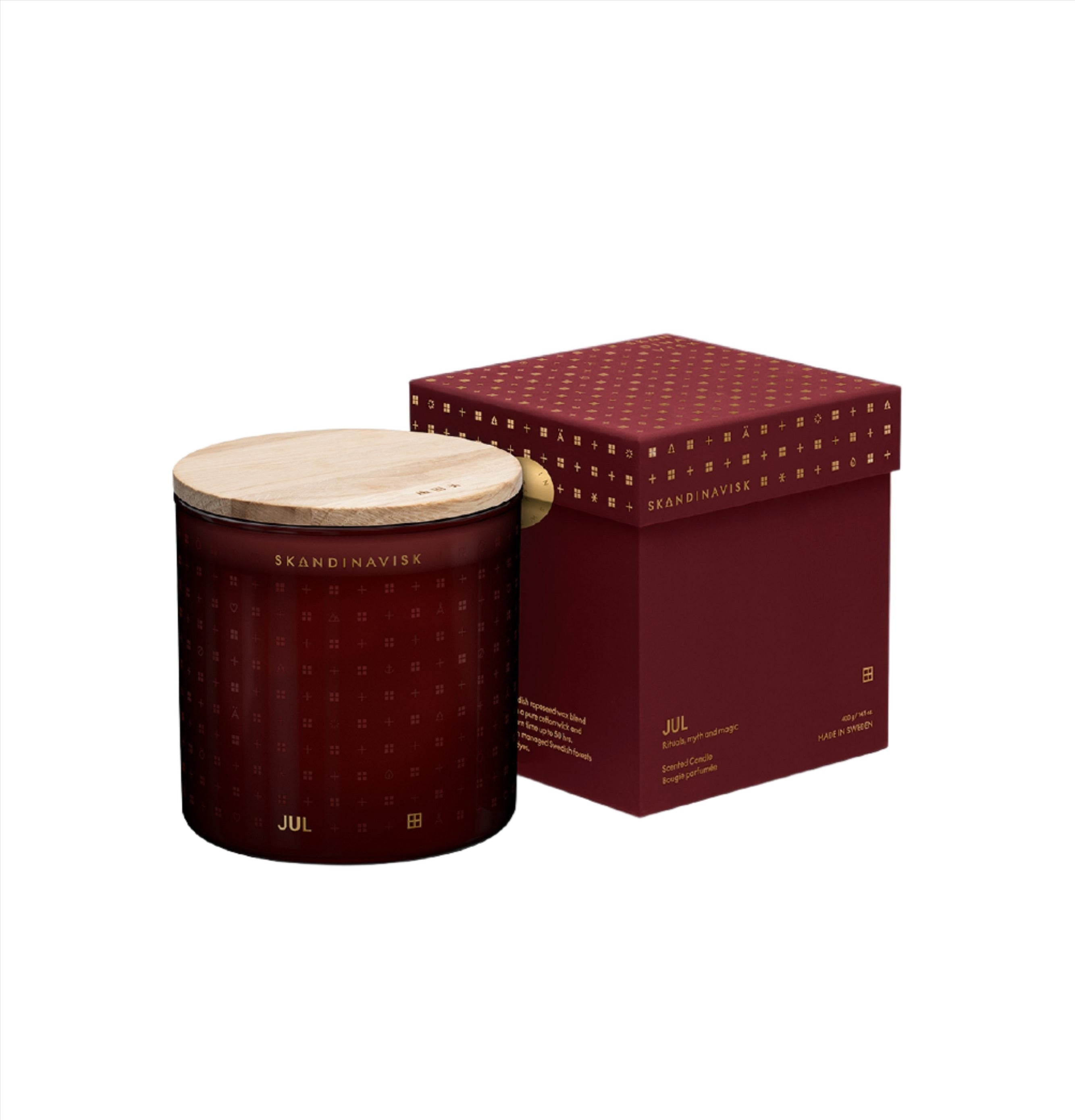 The Skandinavisk Seasonal Jul Scented Candle (2 Wick, 400g) in a red jar with wooden lid is paired with a matching patterned box. Made with Swedish rapeseed wax, it's a perfect Scandinavian gift for the holidays.