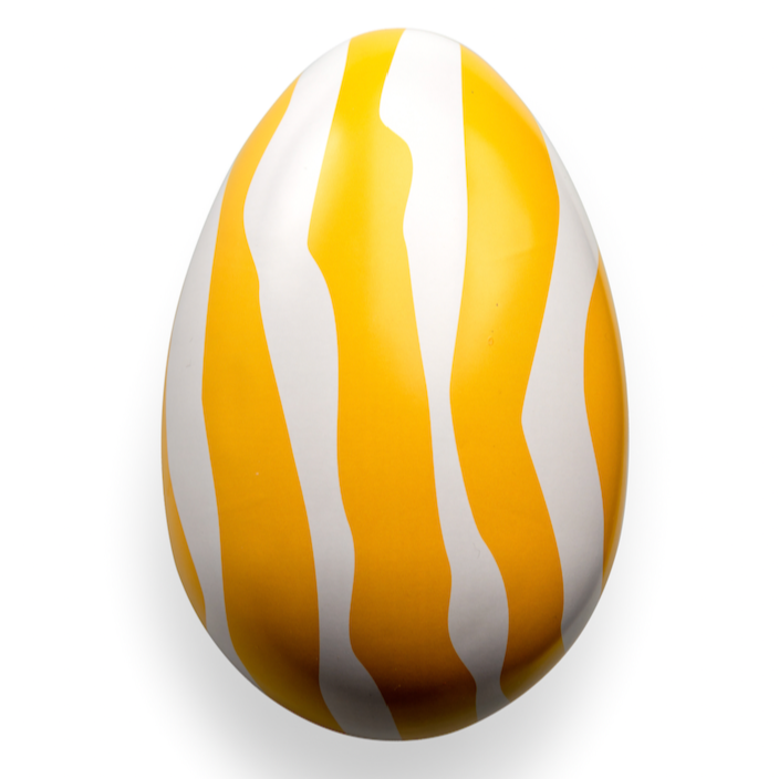 The Gåva Gifting Zebran Reusable Easter Egg is a smooth, egg-shaped tin with bold yellow and white zebra stripes, inspired by Swedish-style Påskägg, shown on a plain white background.