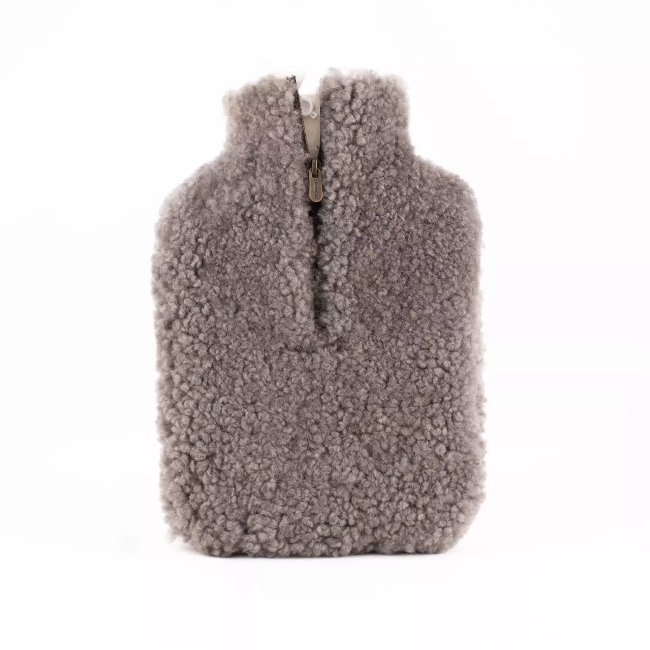 The Shepherd of Sweden Kerri Hot Water Bottle Cover in stone-colored sheepskin features soft, curly fleece and a top-center zipper—perfect for soothing warmth and muscle relief.