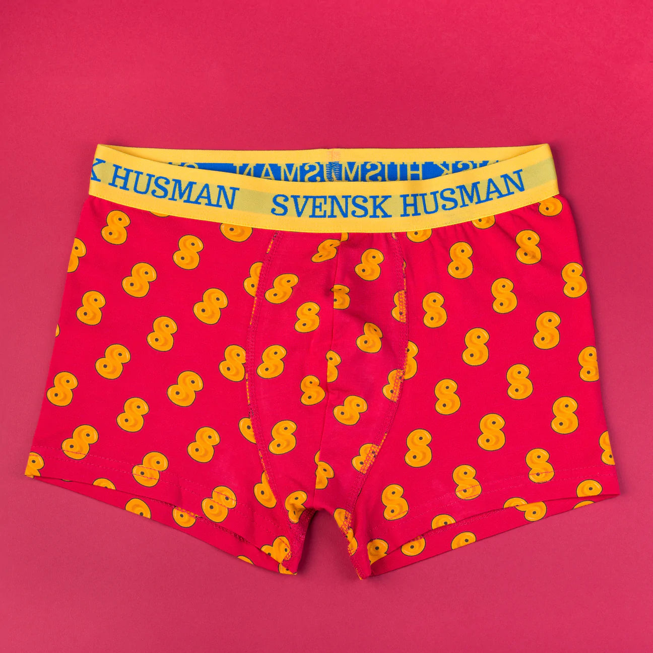 Lussebulle (Saffron Bun) Boxershorts by Svensk Husman Socks: red cotton boxer briefs with a yellow waistband and playful saffron bun pattern.