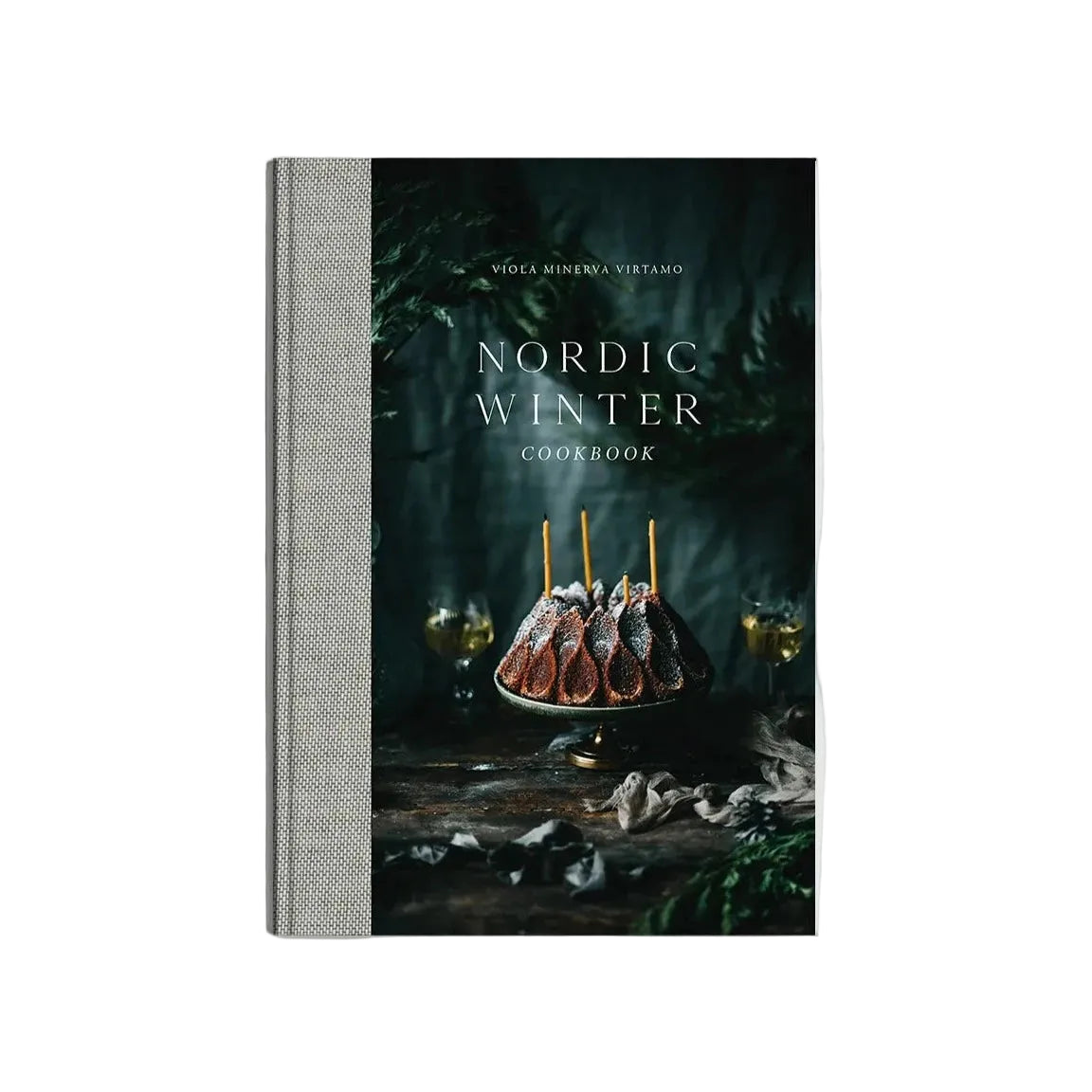 Nordic Winter - Cook Book by Cozy Publishing features a cover with a powdered sugar bundt cake, greenery, and two glasses—ideal for fans of Nordic winter recipes and Finnish Christmas cuisine.