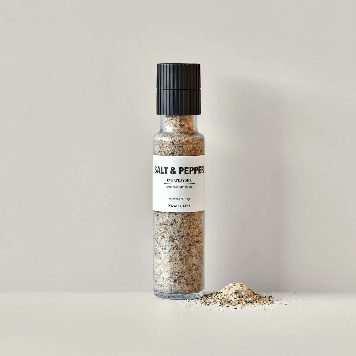 Salt and pepper shaker on a neutral background