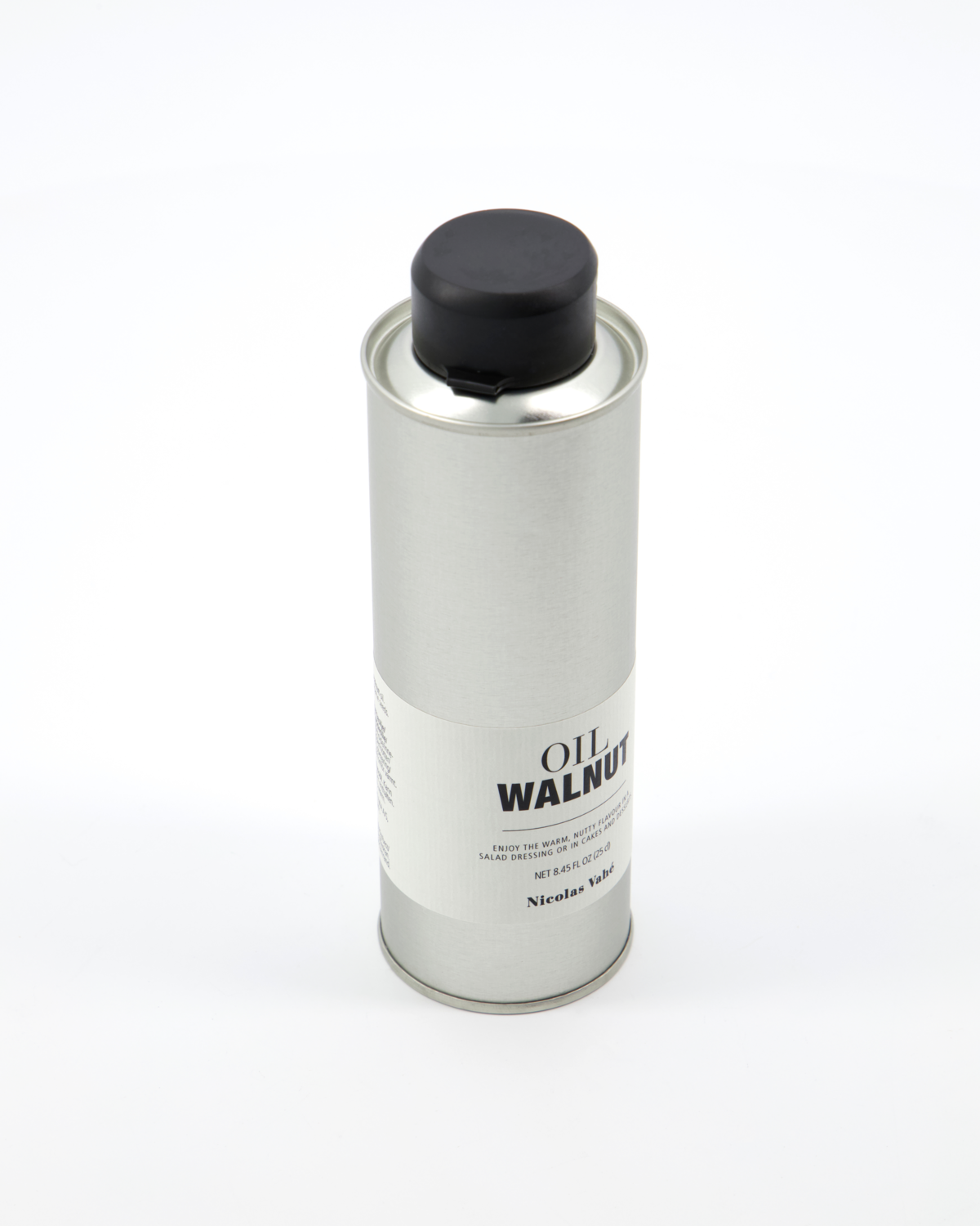A silver metal can with a black cap labeled Walnut Oil by Nicolas Vahé stands upright on a white background. The French finishing oil features black text and smaller lettering under the main title on its label.