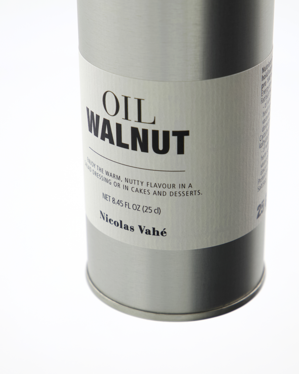 A 8.45 fl oz (25 cl) metal tin of Nicolas Vahé Walnut Oil, made in France, features a nutty flavor ideal for dressings, cakes, and desserts.