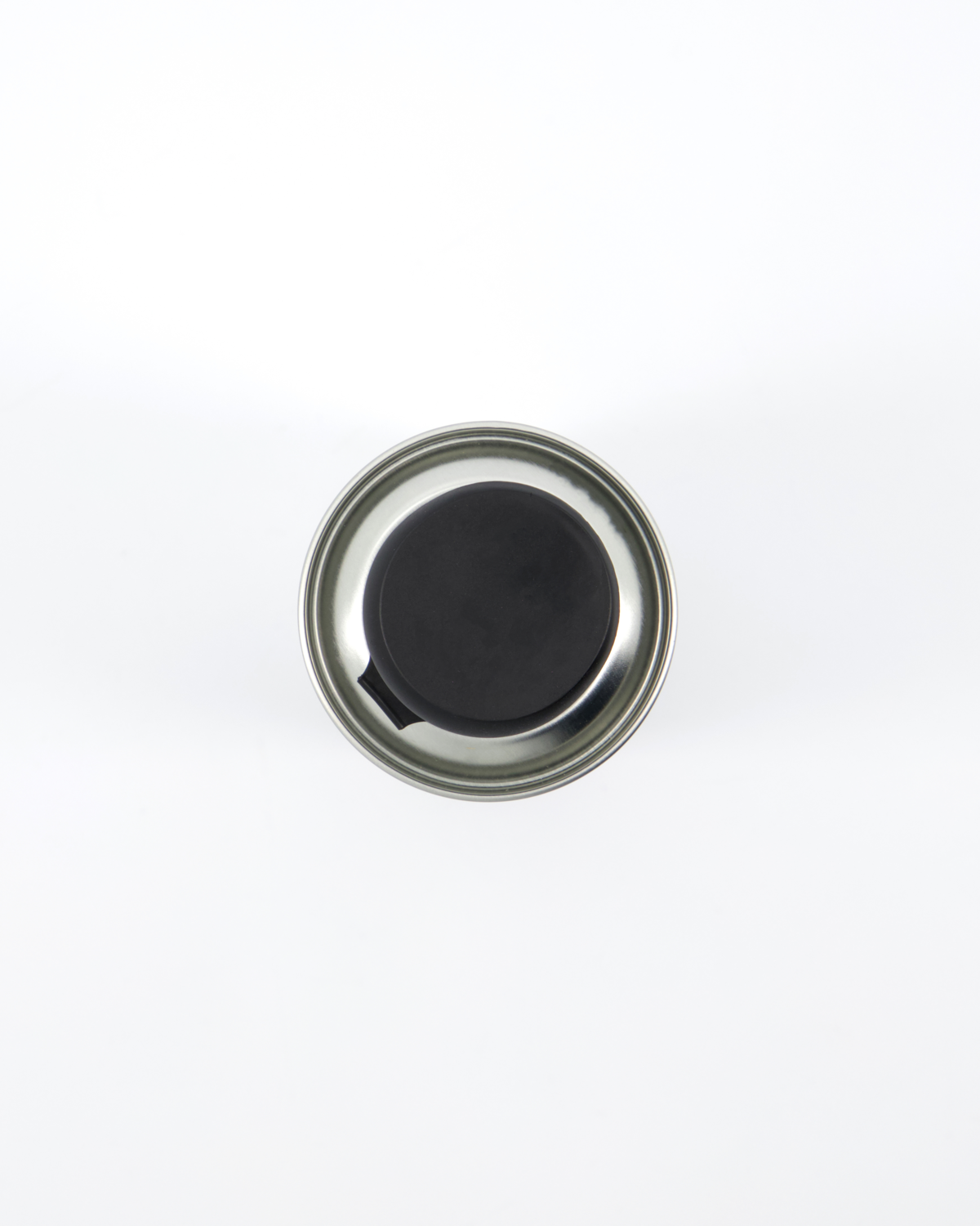 A metal can of Nicolas Vahé Walnut Oil with a black plastic cap, viewed from above against a white background.