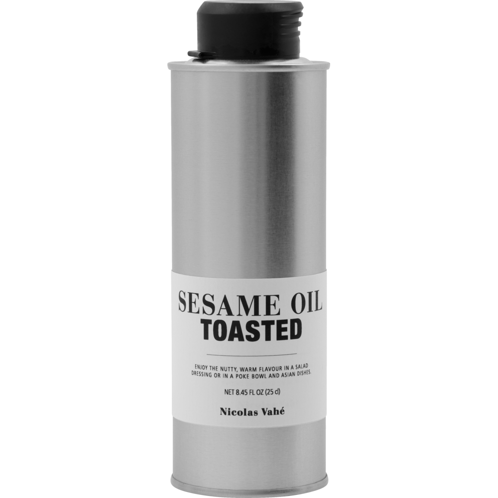 A silver metal can of Sesame Oil, Toasted by Nicolas Vahé with a black cap, featuring a nutty flavor. The label shows serving suggestions and the volume, 8.45 fl oz (250 ml).