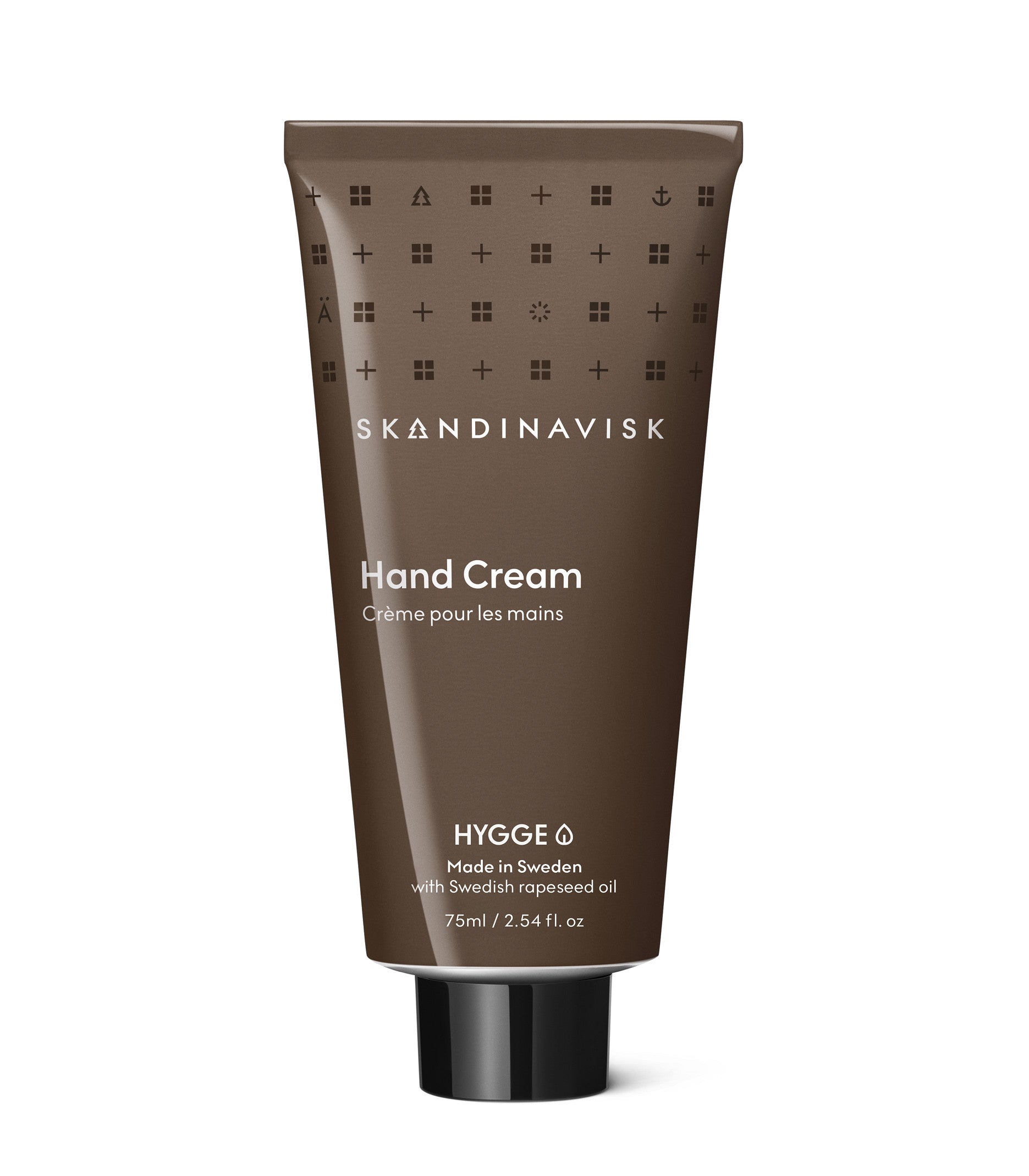 A 75 ml tube of Skandinavisk Hand Cream Hygge in brown packaging, labeled as a gentle vegan moisturizer made in Sweden with Swedish rapeseed oil and enriched with organic aloe vera.