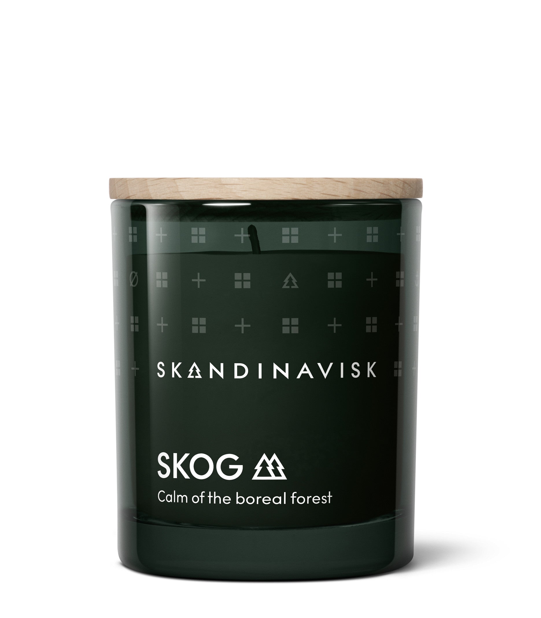 A dark green glass candle with a wooden lid from Skandinavisk, labeled “SKOG Calm of the boreal forest” in white text and adorned with minimalist Nordic design symbols. Featuring the Twilight scent, this candle is part of the Giftset Scented Candle Twilight with 2 Mini Candles Skog & Hygge, inspired by serene Scandinavian woodland evenings and designed to pair perfectly with other SKOG HYGGE giftsets.