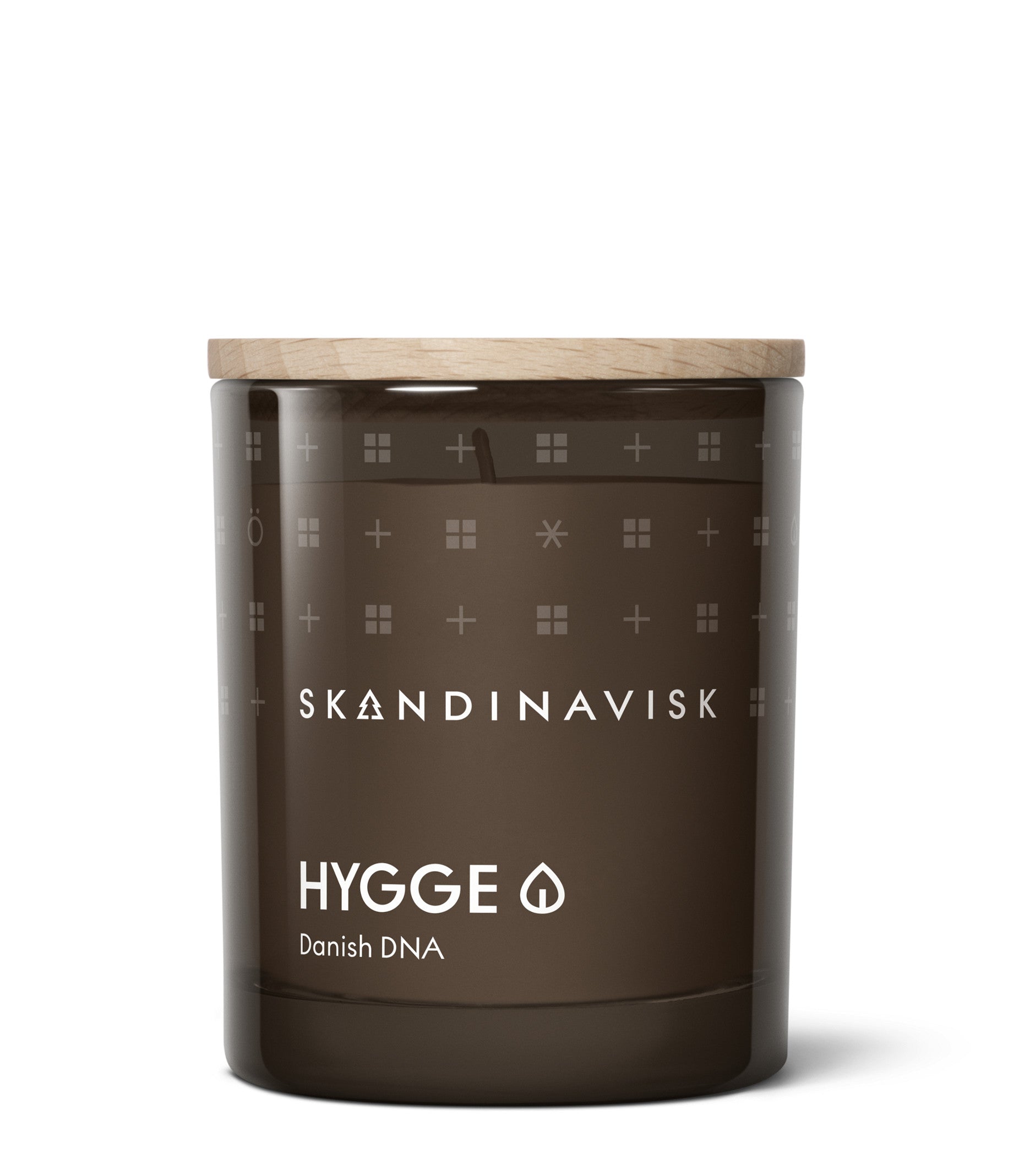 A beautifully designed candle gift set from Skandinavisk, the Giftset Scented Candle Twilight with 2 Mini Candles (Skog & Hygge), features Nordic symbols and a minimalist design on brown glass jars with wooden lids. Inspired by Scandinavian forests, this elegant set infuses any space with the inviting warmth of Twilight, complemented by the evocative scents of both Skog and Hygge.
