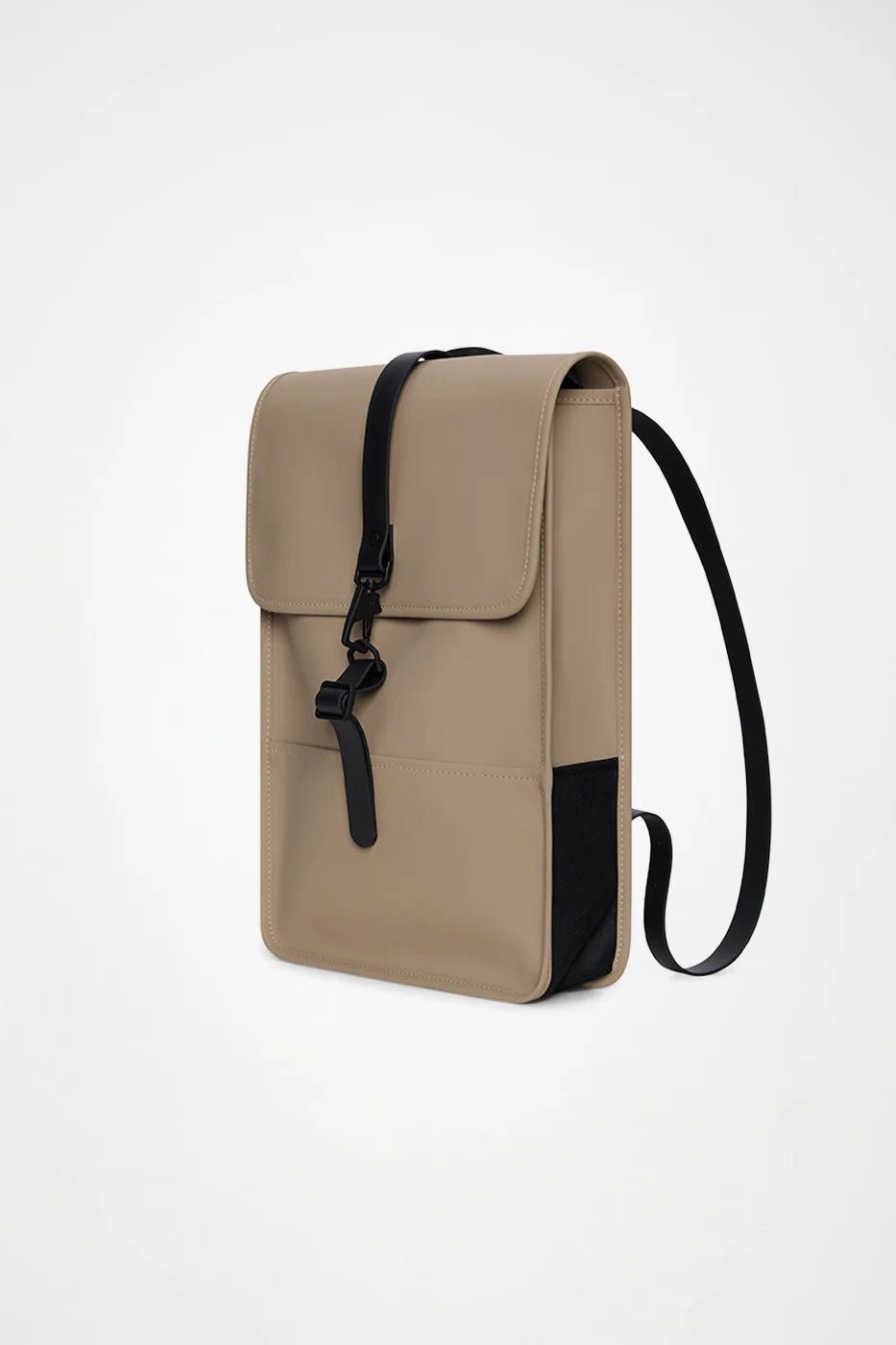 The Rains Backpack Mini Bag in Beige by Rains features a minimalist rectangular silhouette with a black adjustable strap and a front flap fastened by a black buckle. Designed for everyday essentials or as a compact commuter rucksack, its modern, streamlined look showcases clean lines and discreet branding.