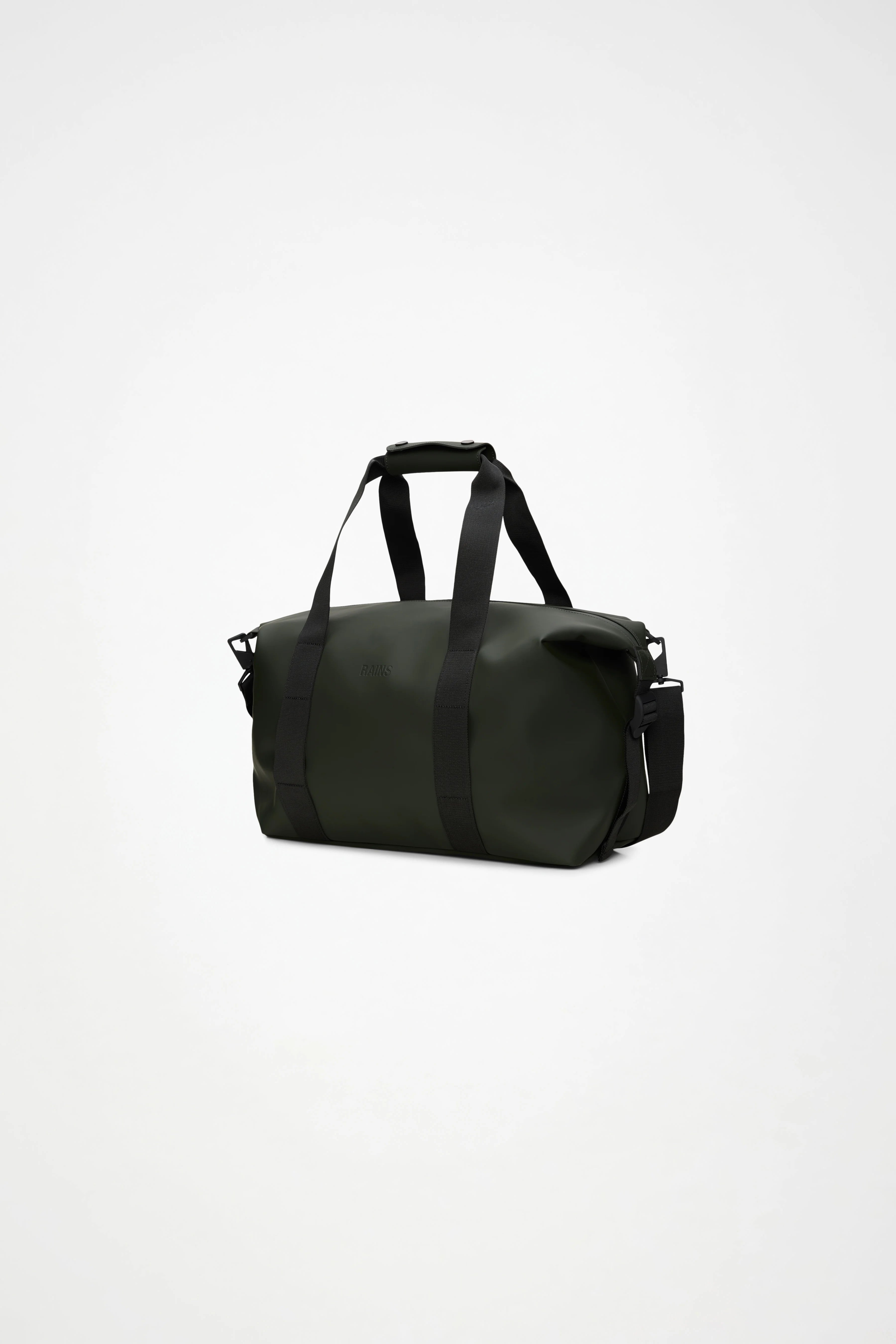 The Rains Hilo Weekend Bag Small in Green by Rains is shown here with black handles and an adjustable shoulder strap, set against a plain white background. This compact travel bag is waterproof, making it both stylish and practical as an overnight or weekend bag for your next adventure.