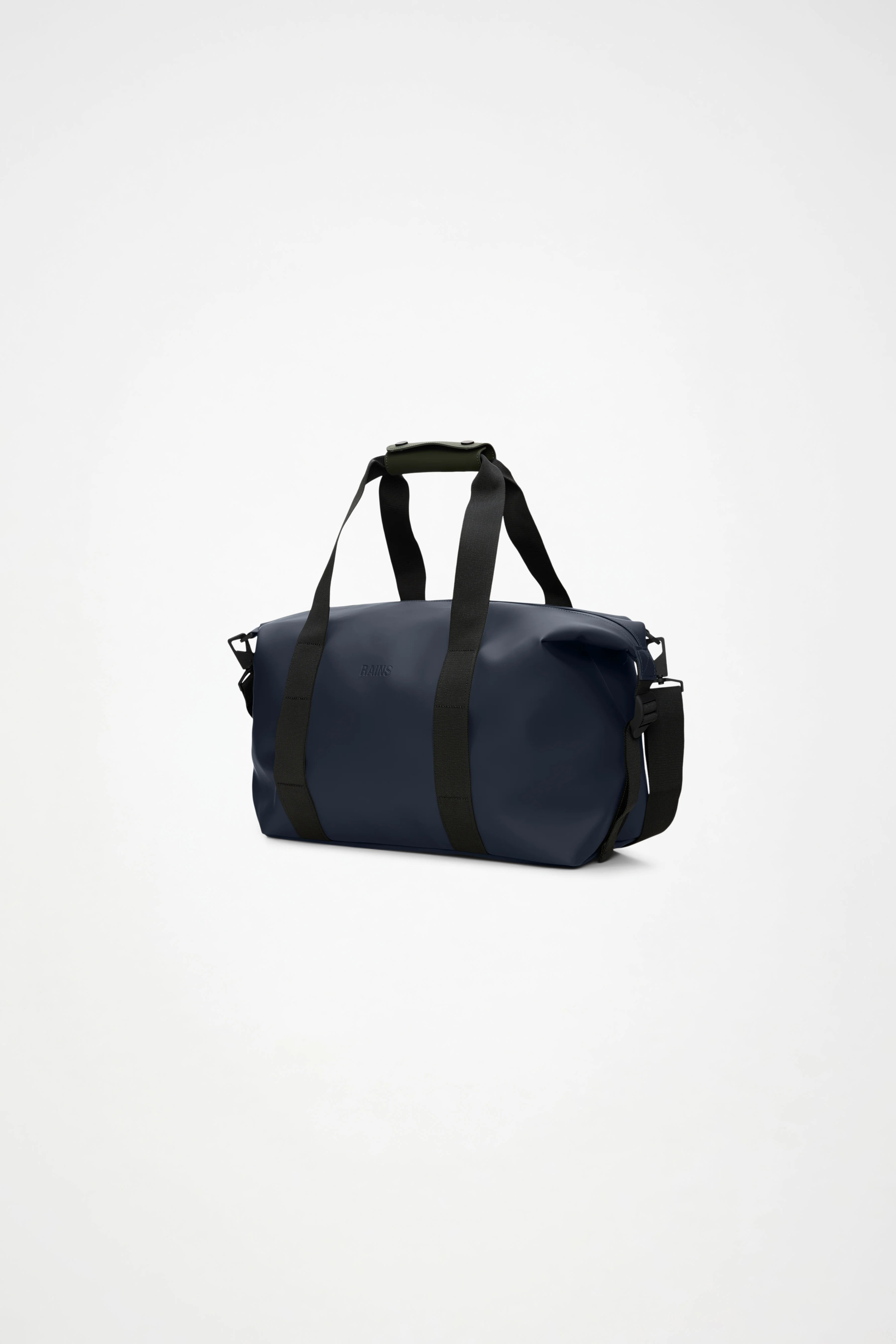 A Rains Hilo Weekend Bag Small in Navy, featuring black shoulder straps and a detachable crossbody strap, is displayed on a plain white background. This compact travel bag by Rains combines style and practicality, making it ideal for overnight trips.